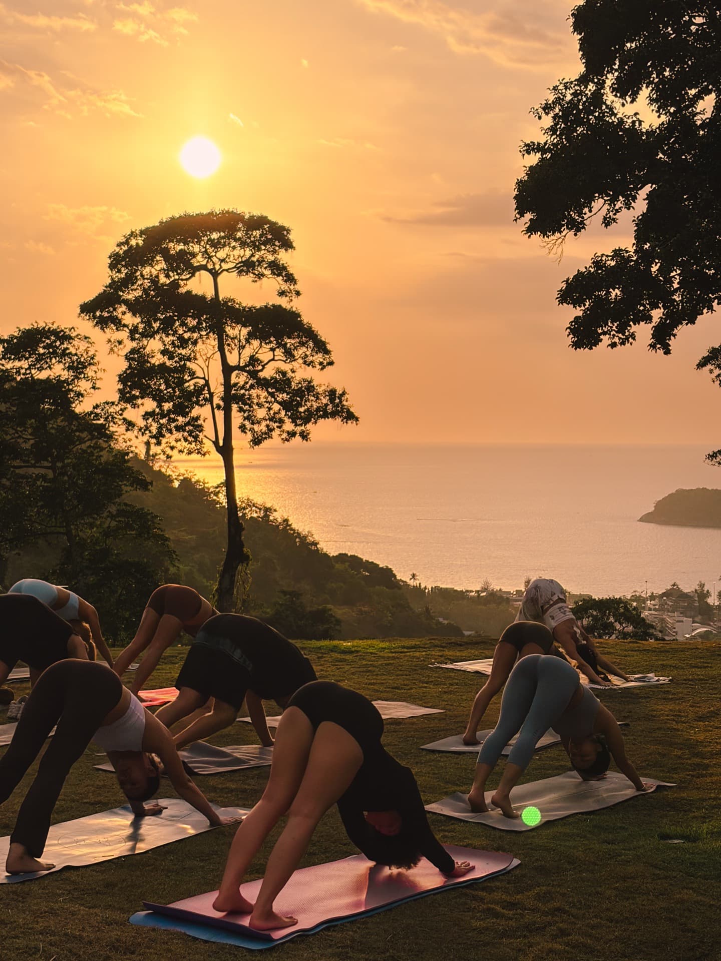 Sunset yoga session on the hilltop overlooking the ocean