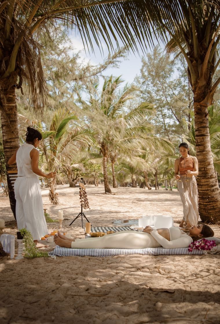 A private sound healing session in a palm grove